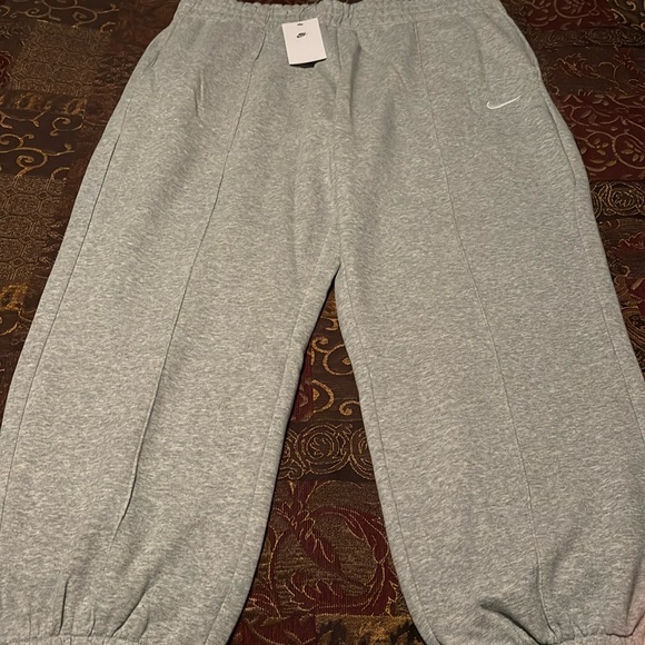 Nike Pants & Jumpsuits Nike Sportswear Fleece Lined Loose Fit Mid Rise Elastic Ankle